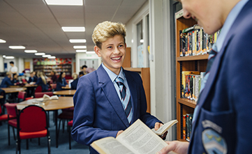 male students in library revising for their scholarship exams