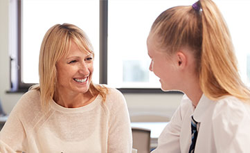 teacher talking with student